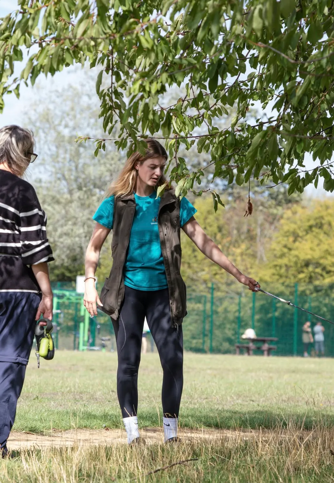 Trainer working with a dog on lead