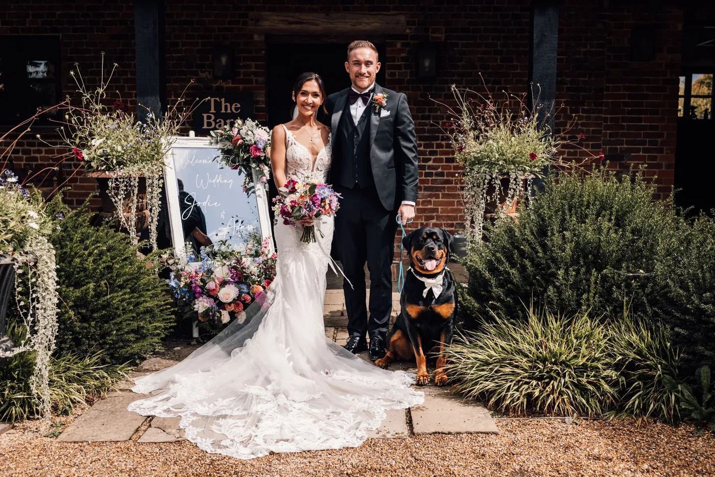Herbert the dog at a wedding with his couple